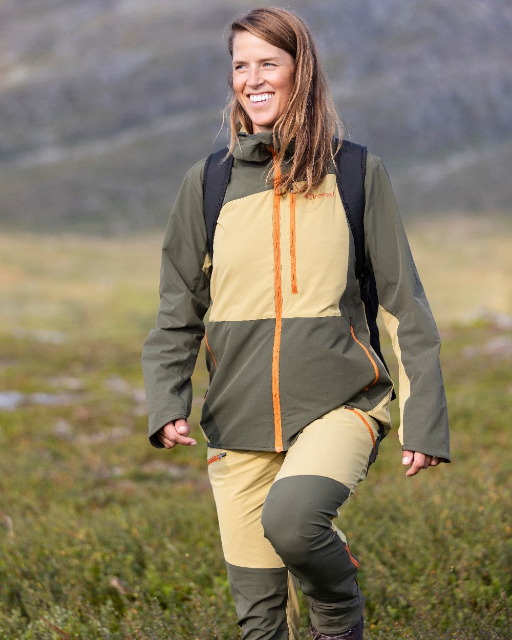 Golden Hay Mossgreen Coloured Pinewood Womens Abisko Light Stretch Trousers on outdoor background #colour_golden-hay-mossgreen