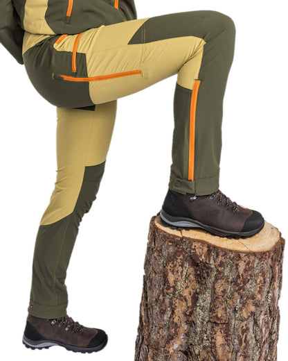Golden Hay Mossgreen Coloured Pinewood Womens Abisko Light Stretch Trousers on white background #colour_golden-hay-mossgreen