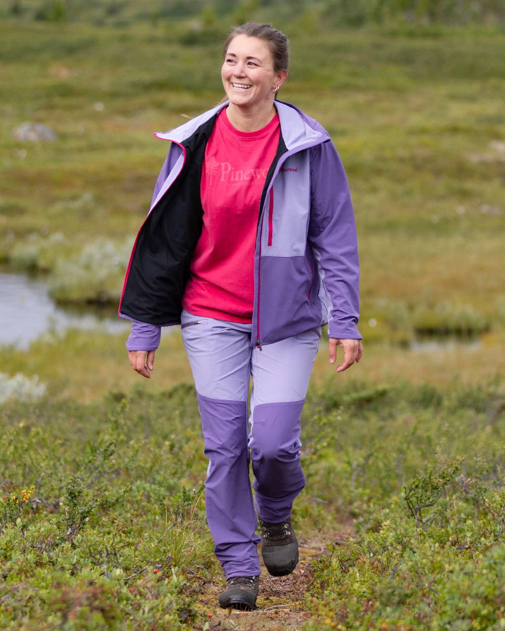 Light Lilac Coloured Pinewood Womens Abisko Light Stretch Trousers on outdoor background #colour_light-lilac