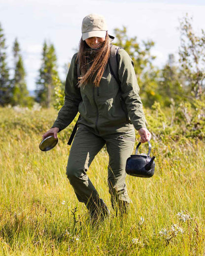 Mossgreen Coloured Pinewood Womens Abisko Light Stretch Trousers on outdoor background #colour_mossgreen