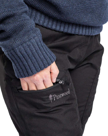 Black coloured Pinewood Womens Caribou TC Trousers on white background #colour_black