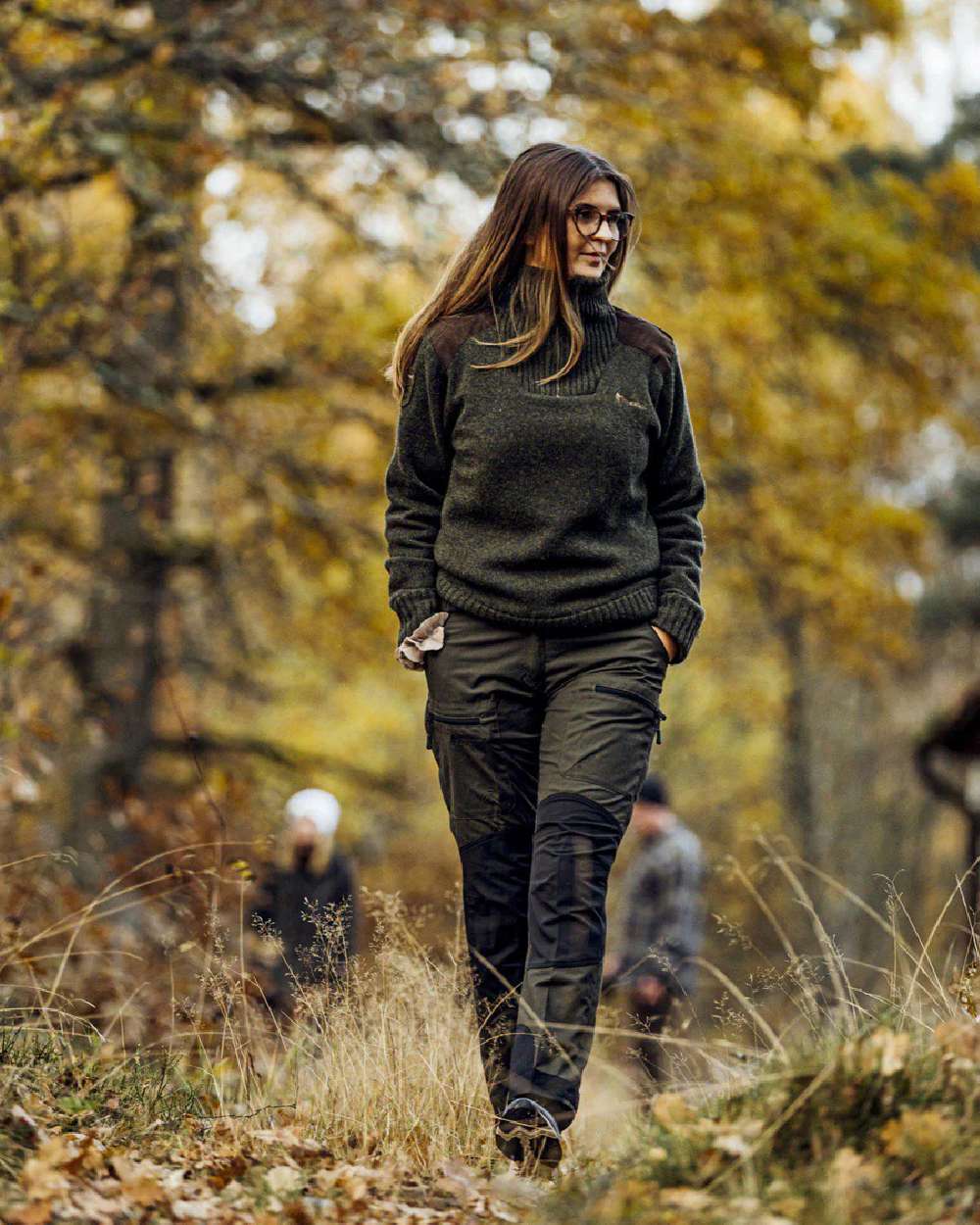 Moss Green Black coloured Pinewood Womens Caribou TC Trousers on forest background #colour_moss-green-black