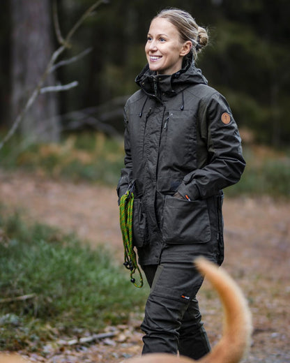 Moss Green Coloured Pinewood Womens Dog Sports Trainer Extreme Jacket on outdoor background #colour_moss-green