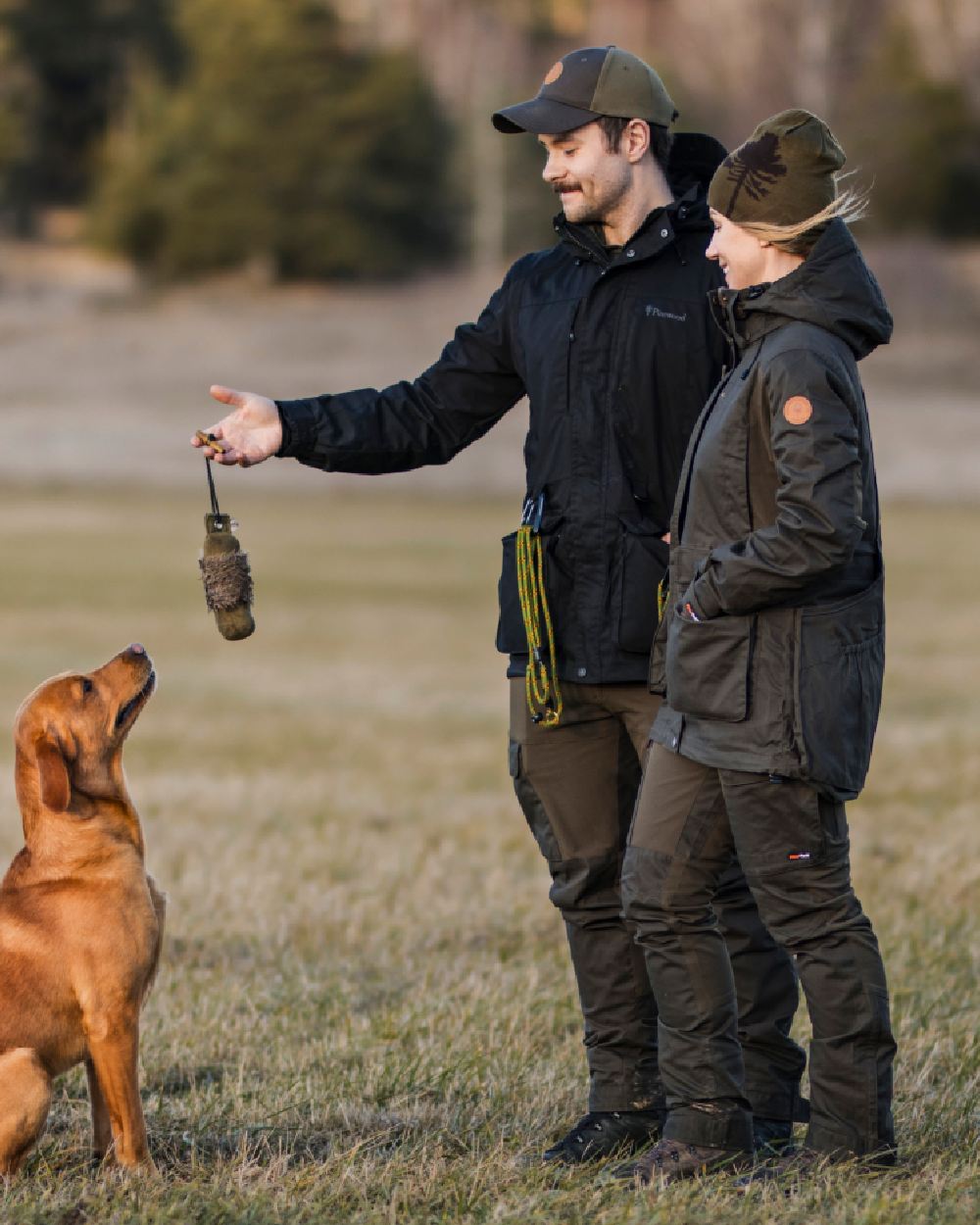 Moss Green Coloured Pinewood Womens Dog Sports Trainer Extreme Jacket on outdoor background #colour_moss-green
