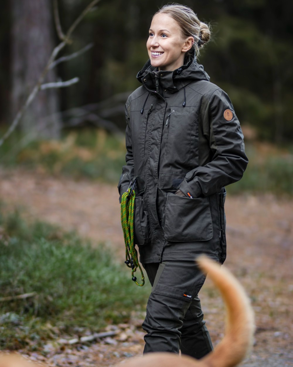 Moss Green Coloured Pinewood Womens Dog Sports Trainer Extreme Trousers on outdoor background #colour_moss-green