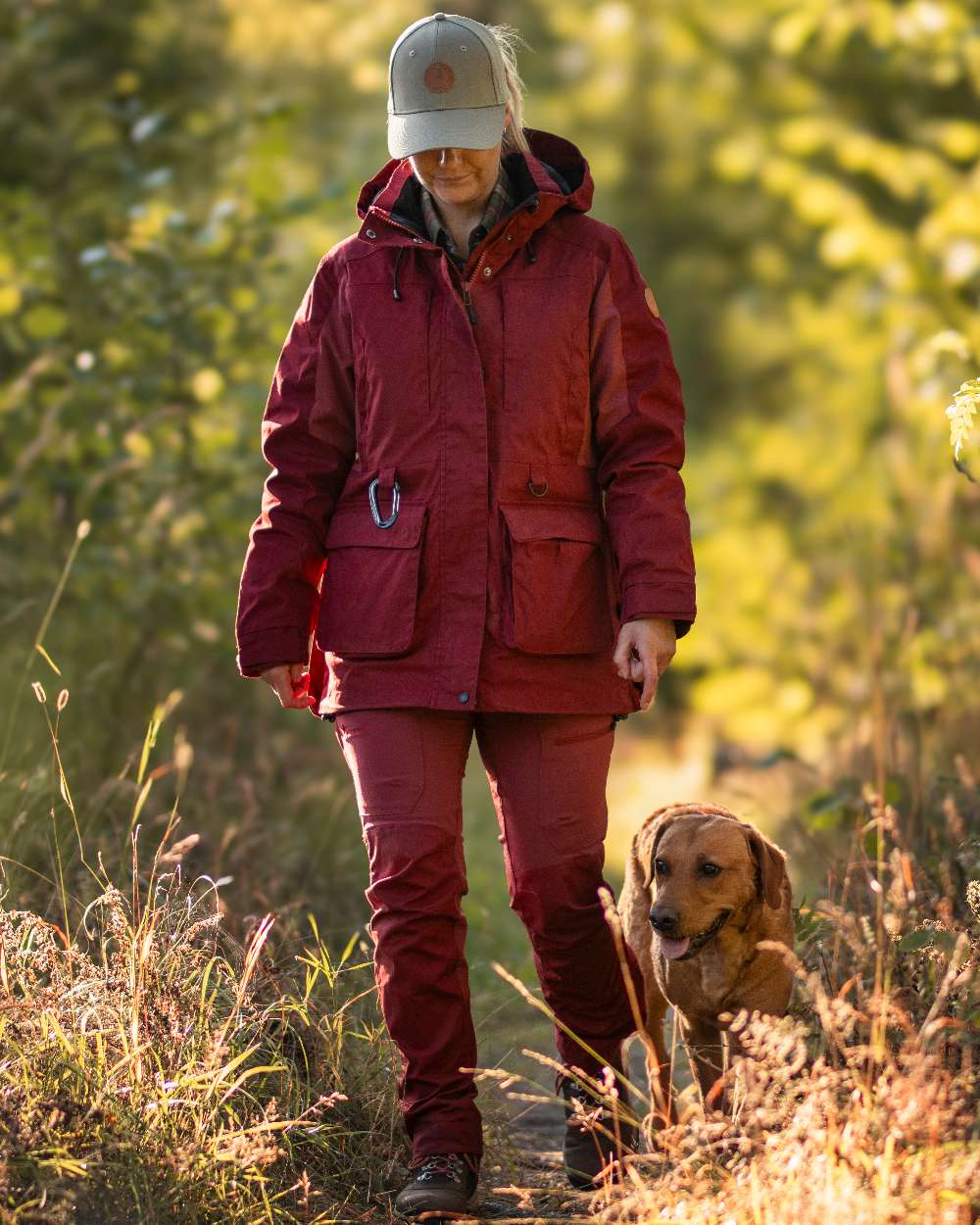 Dark Tomato Dark Red Coloured Pinewood Womens Dog Sports Trainer Jacket on outdoor background #colour_dark-tomato-dark-red