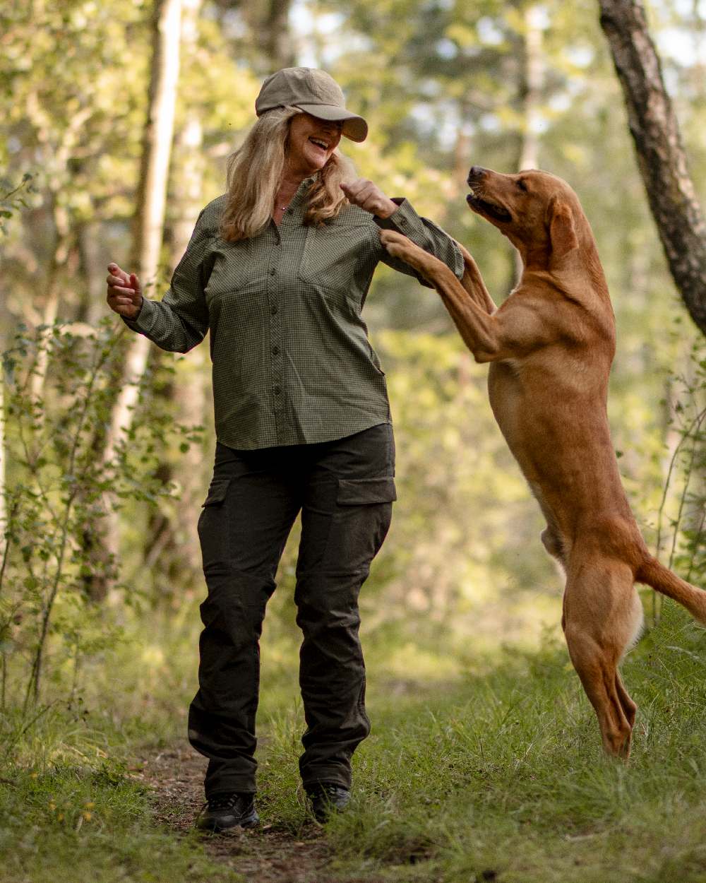 Moss Green Coloured Pinewood Womens Dog Sports Trainer Trousers on outdoor background #colour_moss-green