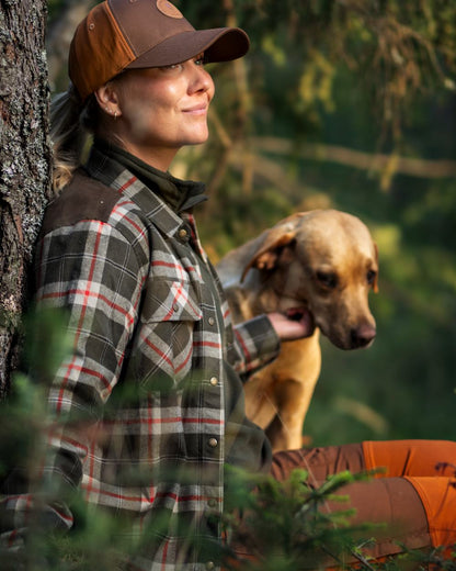 Dark Green Red coloured Pinewood Womens Douglas Shirt on forest background #colour_dark-green-red