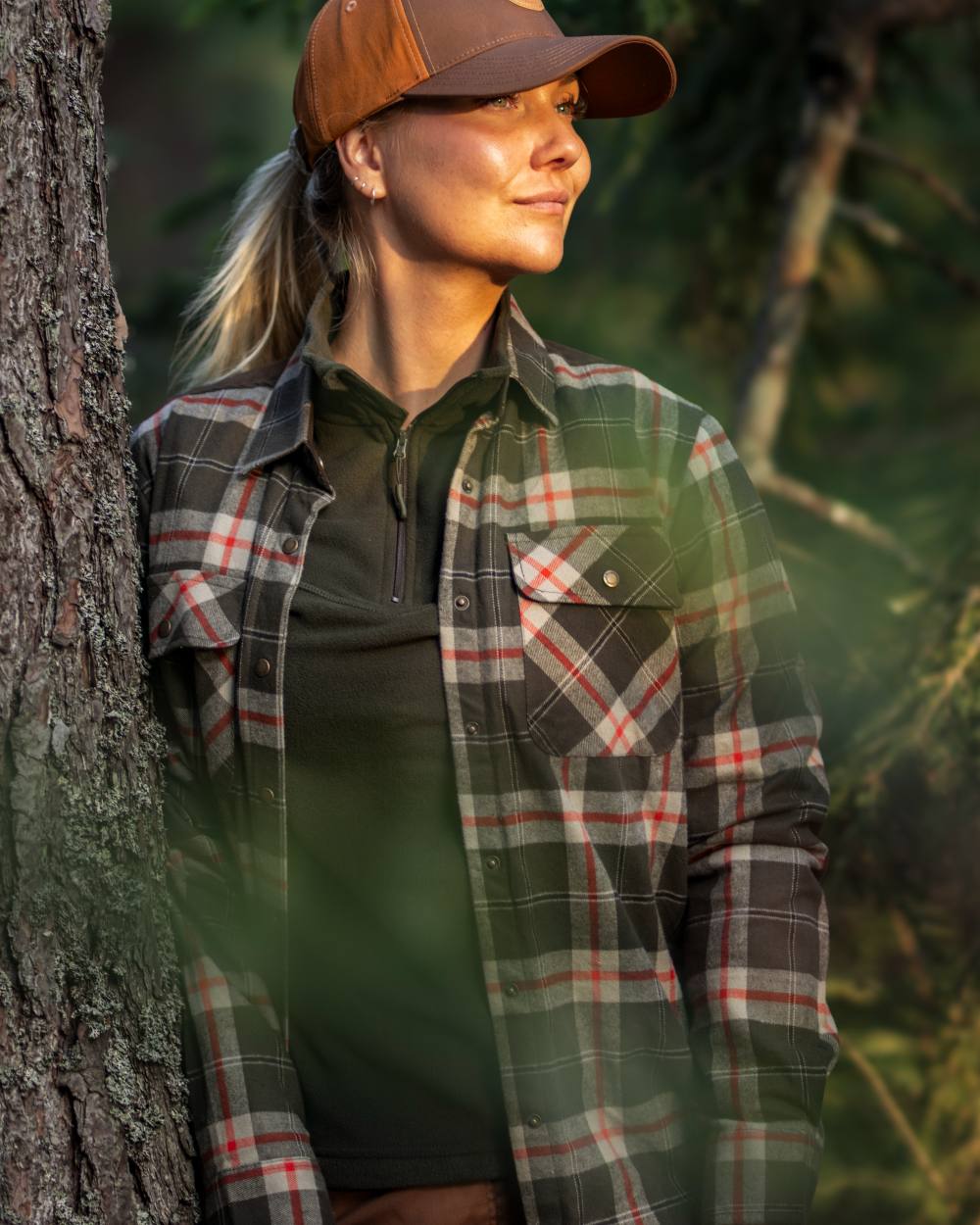 Dark Green Red coloured Pinewood Womens Douglas Shirt on forest background #colour_dark-green-red
