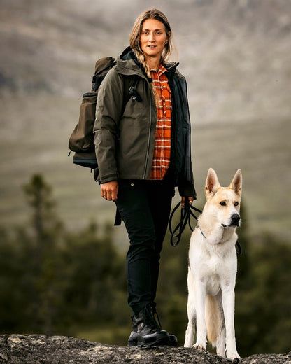 Black Coloured Pinewood Womens Finnveden Classic Trousers on outdoor background #colour_black