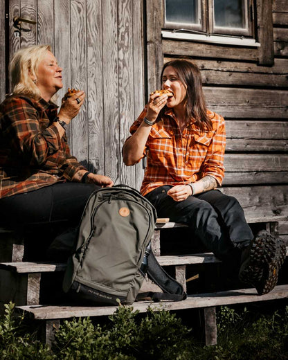 Black Coloured Pinewood Womens Finnveden Classic Trousers on outdoor background #colour_black