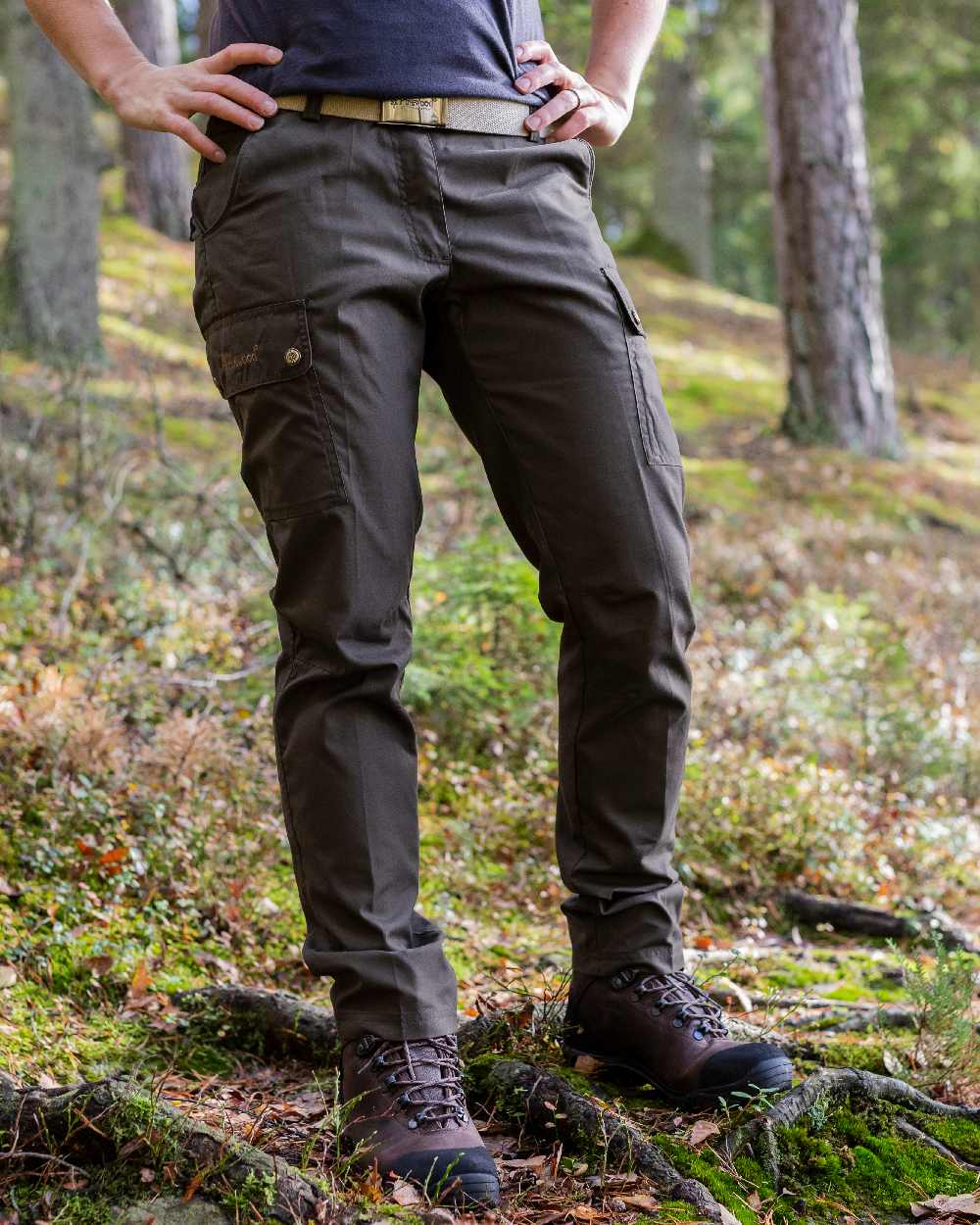 Dark Olive Coloured Pinewood Womens Finnveden Classic Trousers on outdoor background #colour_dark-olive