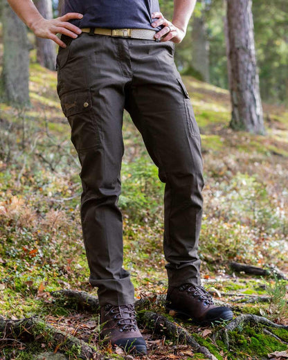 Dark Olive Coloured Pinewood Womens Finnveden Classic Trousers on outdoor background #colour_dark-olive