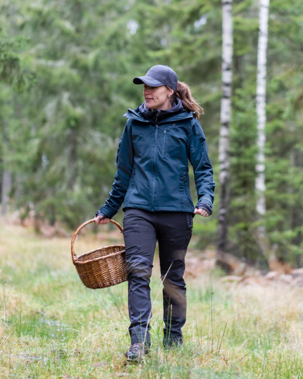 Dark Dive Coloured Pinewood Womens Finnveden Hybrid Extreme Jacket on outdoor background #colour_dark-dive