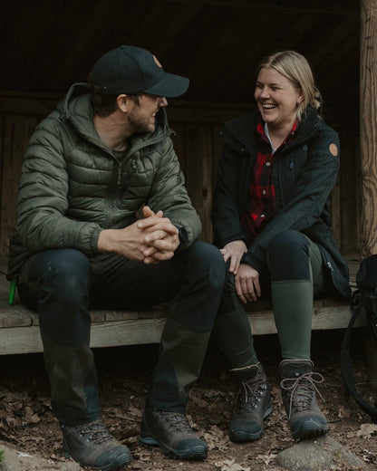 Black Coloured Pinewood Womens Finnveden Hybrid Jacket on outdoor background #colour_black
