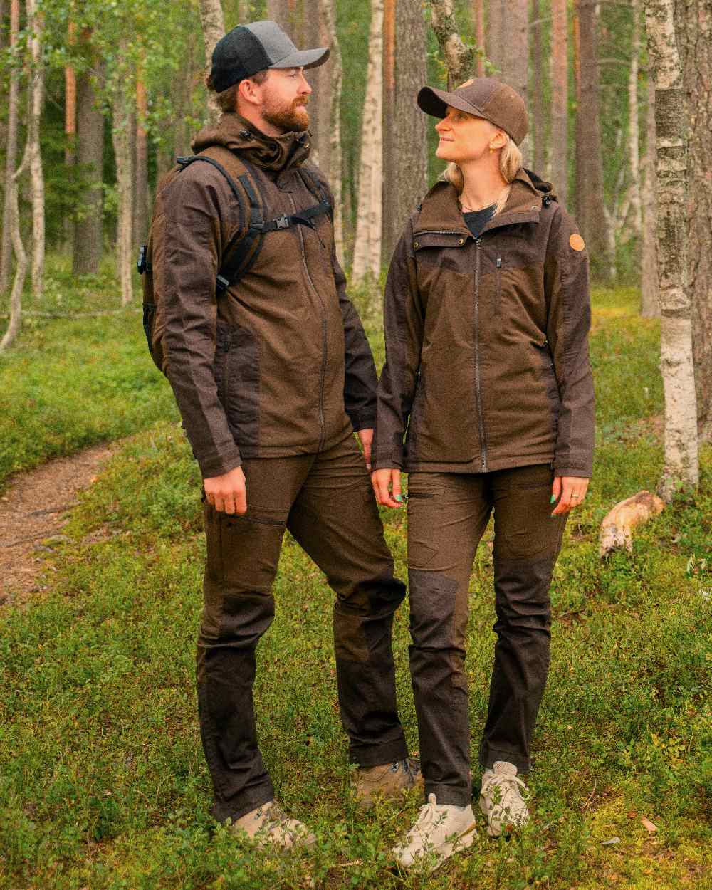 Dark Brown Coloured Pinewood Womens Finnveden Hybrid Jacket on outdoor background #colour_dark-brown