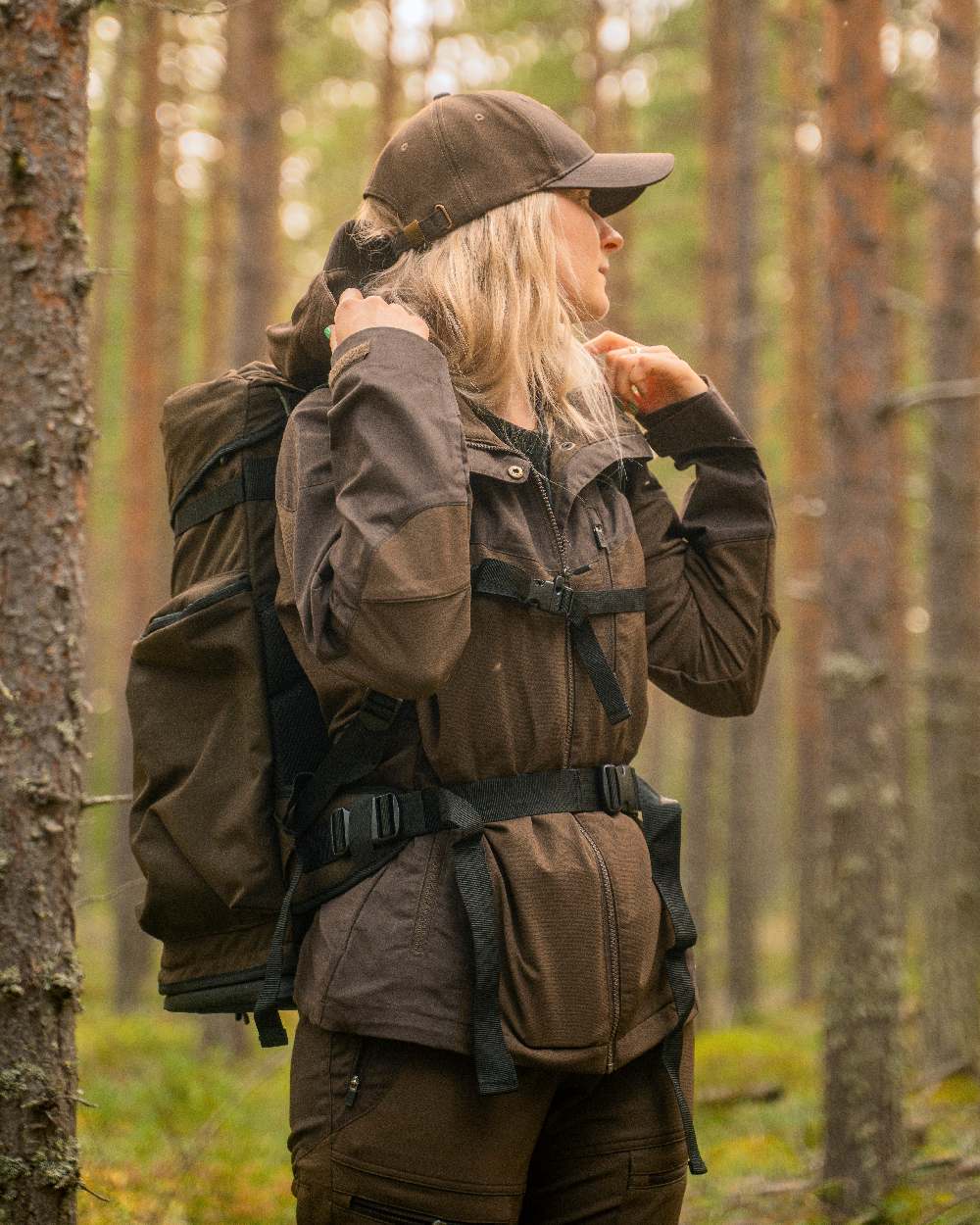 Dark Brown Coloured Pinewood Womens Finnveden Hybrid Jacket on outdoor background #colour_dark-brown