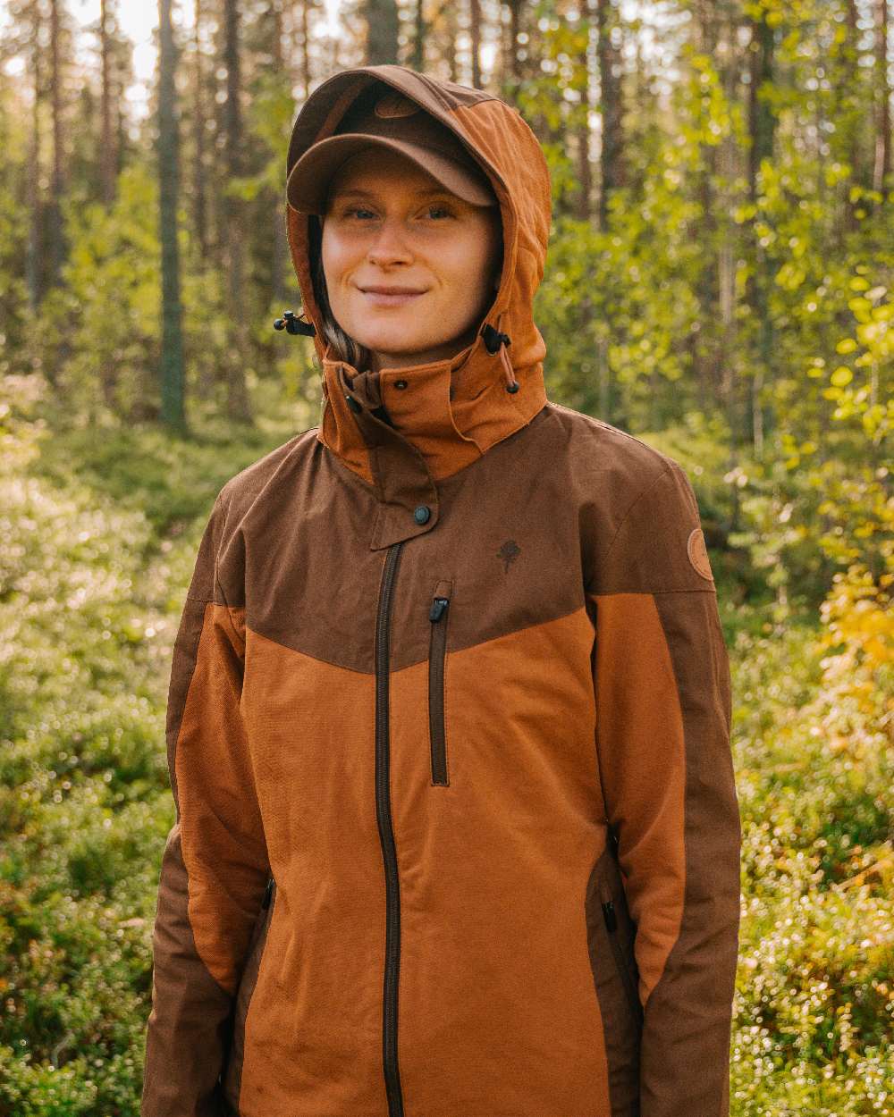 Fudge Nougat Coloured Pinewood Womens Finnveden Hybrid Jacket on outdoor background #colour_fudge-nougat
