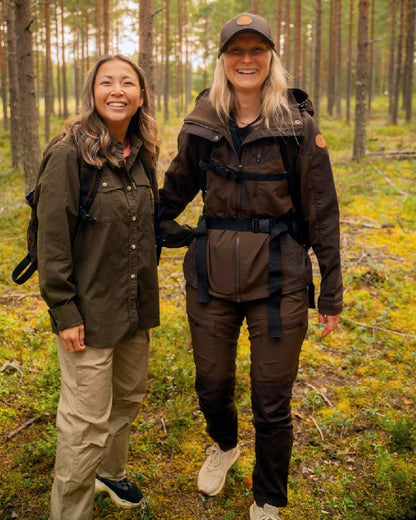 Dark Brown Coloured Pinewood Womens Finnveden Hybrid Trousers on outdoor background #colour_dark-brown
