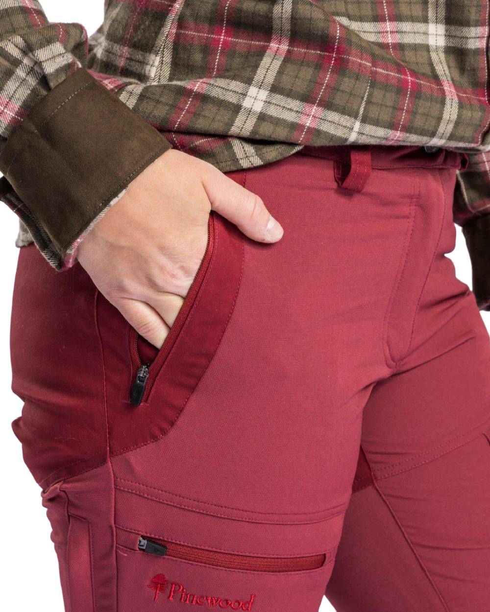 Dark Red Dark Tomato coloured Pinewood Womens Finnveden Hybrid Trousers on white background #colour_dark-red-dark-tomato