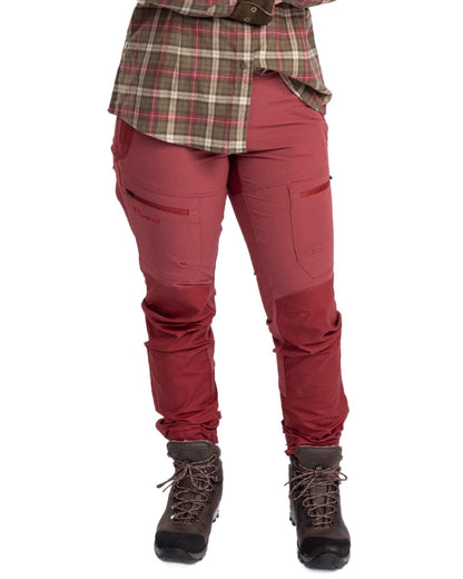 Dark Red Dark Tomato coloured Pinewood Womens Finnveden Hybrid Trousers on white background #colour_dark-red-dark-tomato