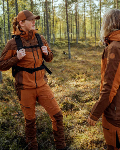 Fudge Nougat Coloured Pinewood Womens Finnveden Hybrid Trousers on outdoor background #colour_fudge-nougat