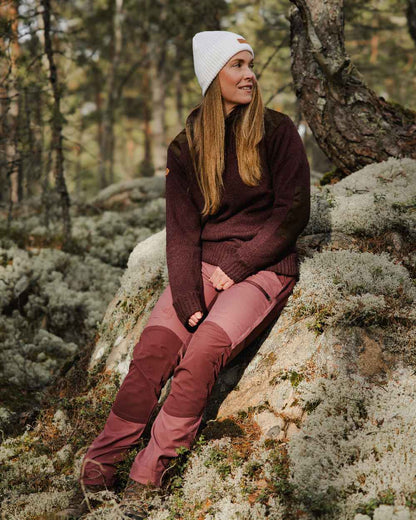 Dark Burgundy Mel Coloured Pinewood Womens Hurricane Knitted Sweater on outdoor background #colour_dark-burgundy-mel