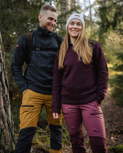 Dark Burgundy Mel Coloured Pinewood Womens Hurricane Knitted Sweater on outdoor background #colour_dark-burgundy-mel