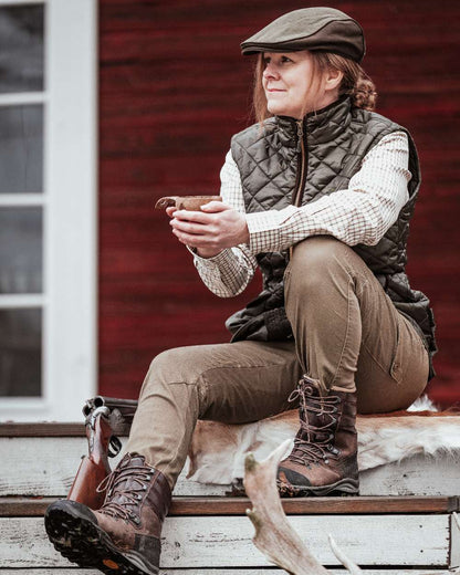 Hunting Olive Coloured Pinewood Womens Serengeti Trousers on outdoor background #colour_hunting-olive