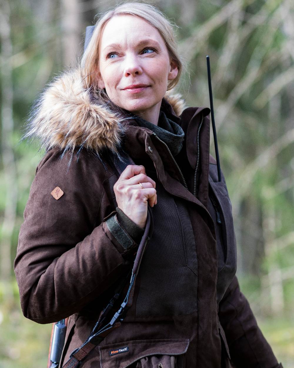 Suede Brown Coloured Pinewood Womens Smaland Abisko 2.0 Hunting Jacket on forest background #colour_suede-brown