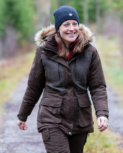 Suede Brown Coloured Pinewood Womens Smaland Abisko 2.0 Hunting Jacket on forest background #colour_suede-brown