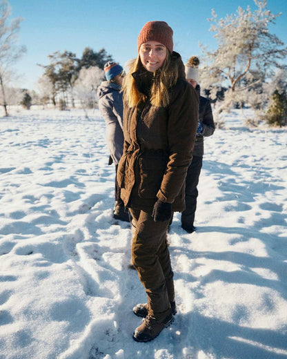 Suede Brown Coloured Pinewood Womens Smaland Abisko 2.0 Hunting Jacket on snow background #colour_suede-brown