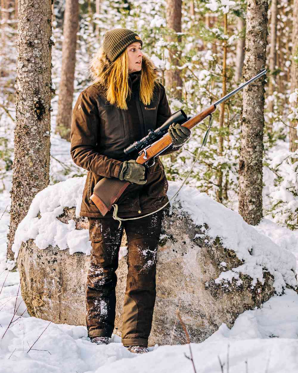 Suede Brown Coloured Pinewood Womens Smaland Abisko 2.0 Hunting Jacket on snow background #colour_suede-brown