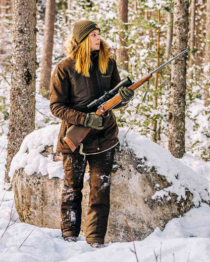 Suede Brown Coloured Pinewood Womens Smaland Abisko 2.0 Hunting Jacket on snow background #colour_suede-brown