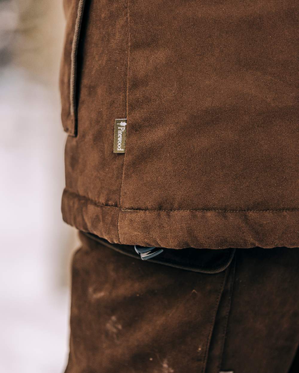 Suede Brown Coloured Pinewood Womens Smaland Abisko 2.0 Hunting Jacket on snow background #colour_suede-brown