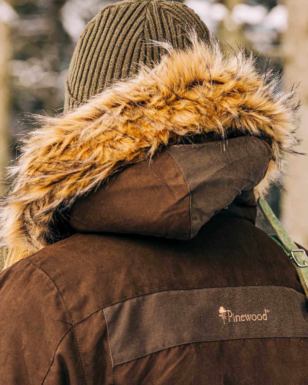 Suede Brown Coloured Pinewood Womens Smaland Abisko 2.0 Hunting Jacket on snow background #colour_suede-brown