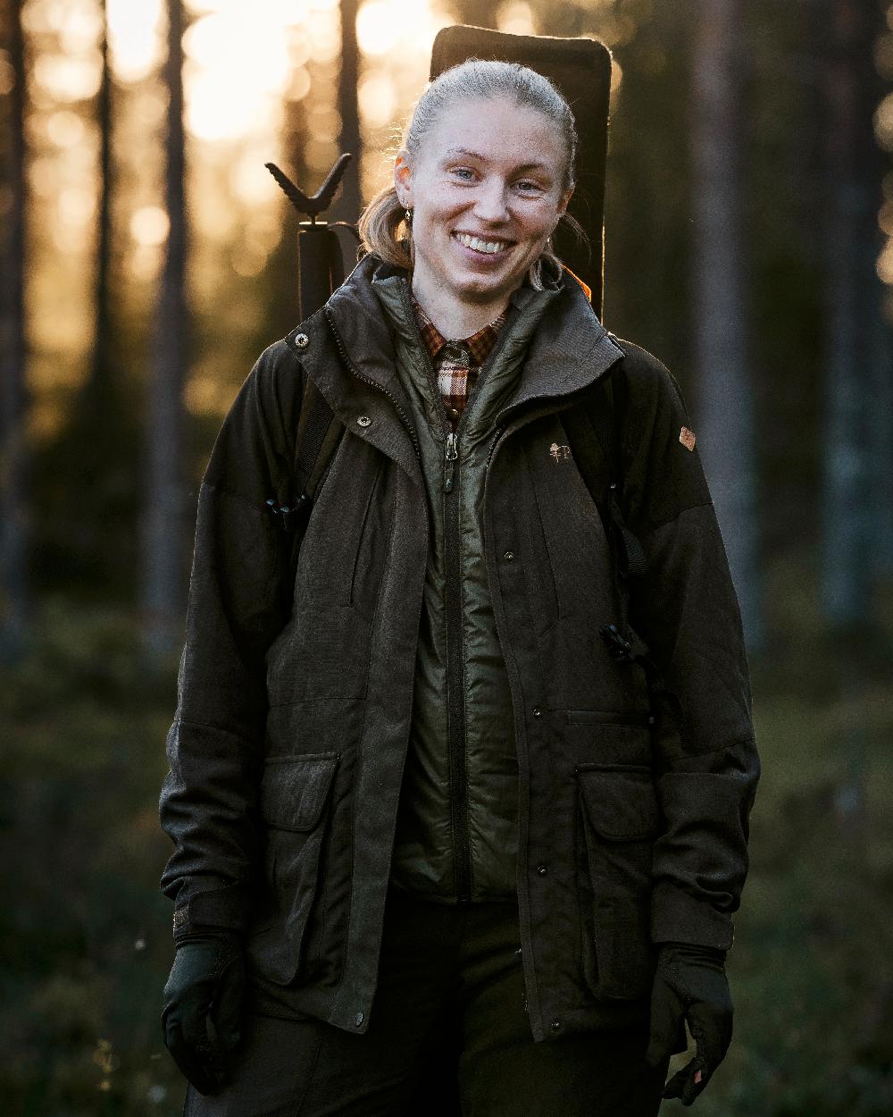 Suede Brown Coloured Pinewood Womens Smaland Hunters Jacket on forest background #colour_suede-brown