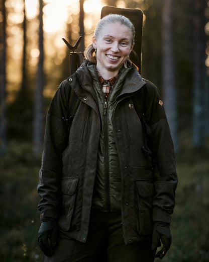 Suede Brown Coloured Pinewood Womens Smaland Hunters Jacket on forest background #colour_suede-brown