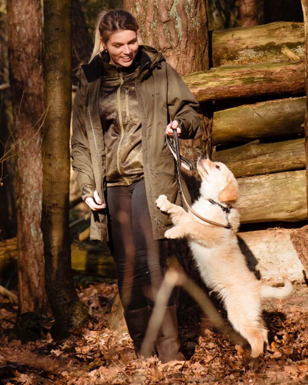 Moss Green coloured Pinewood Womens Wilda Parka on forest background #colour_moss-green