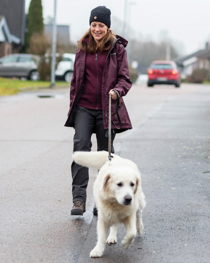 Plum coloured Pinewood Womens Wilda Parka on street background #colour_plum