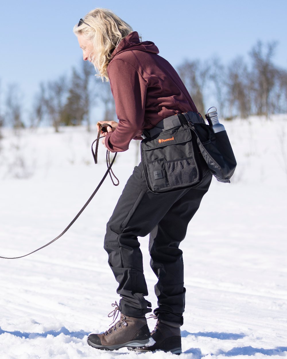 Black Coloured Pinewood Womens Wilda Stretch Shell Trousers on outdoor background #colour_black