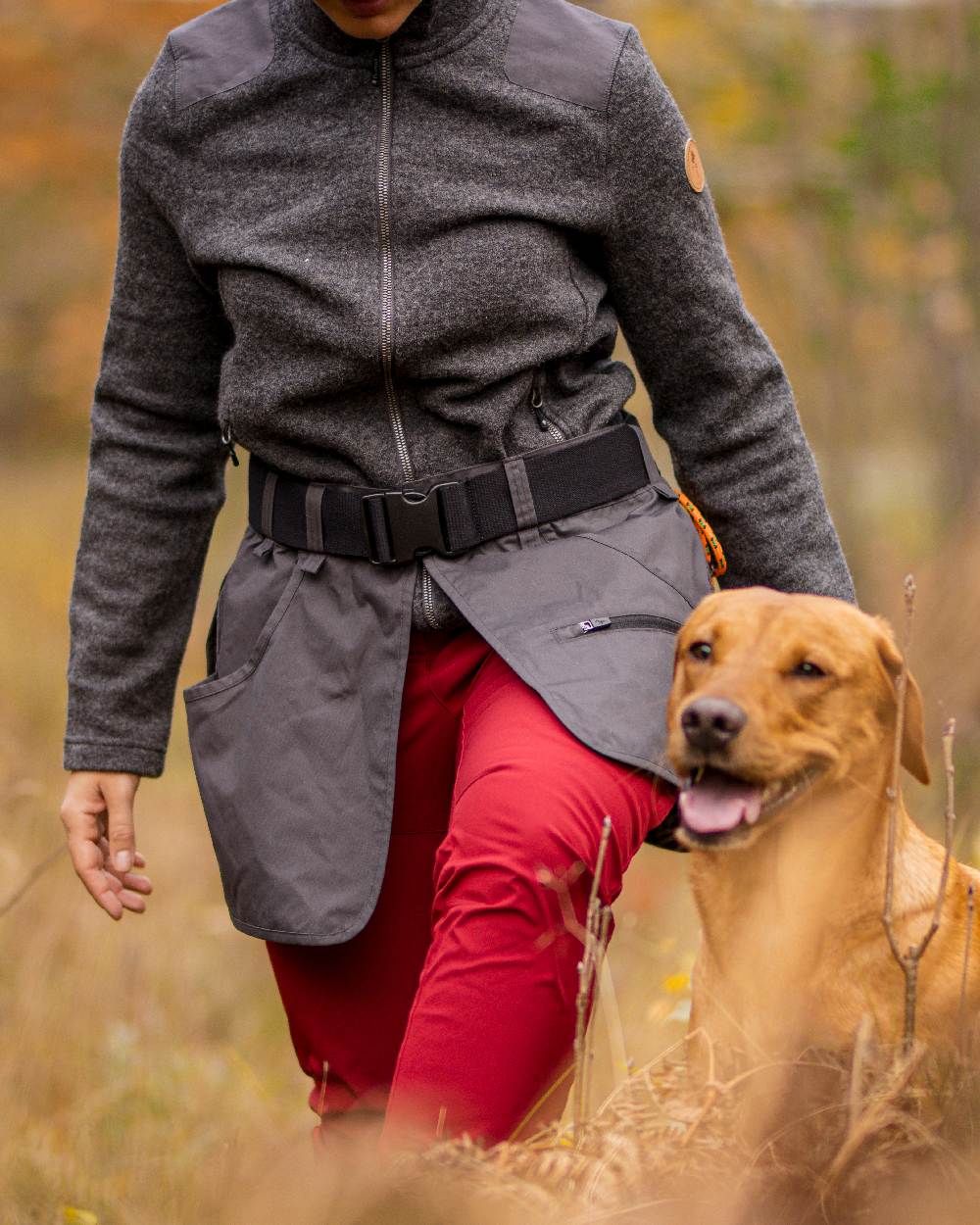 Dark Tomato Coloured Pinewood Womens Wilda Stretch Shell Trousers on outdoor background #colour_dark-tomato