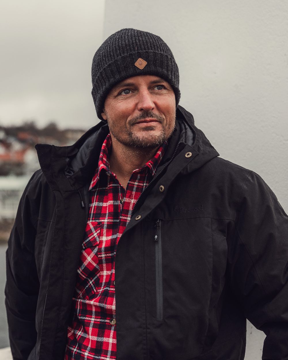 Dark Anthracite Mel Coloured Pinewood Wool Knitted Hat on outdoor background #colour_dark-anthracite-mel