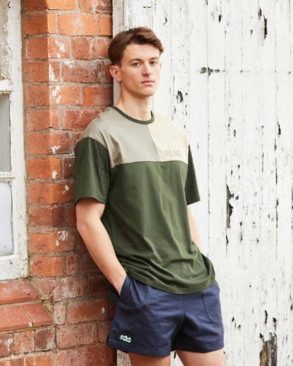 Navy coloured Ridgeline Hose Down Shorts on brick wall background #colour_navy