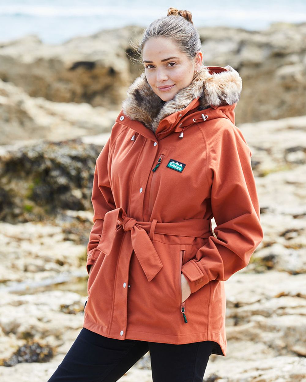Russet coloured Ridgeline Ladies Monsoon Nordic Jacket on sea background #colour_russet