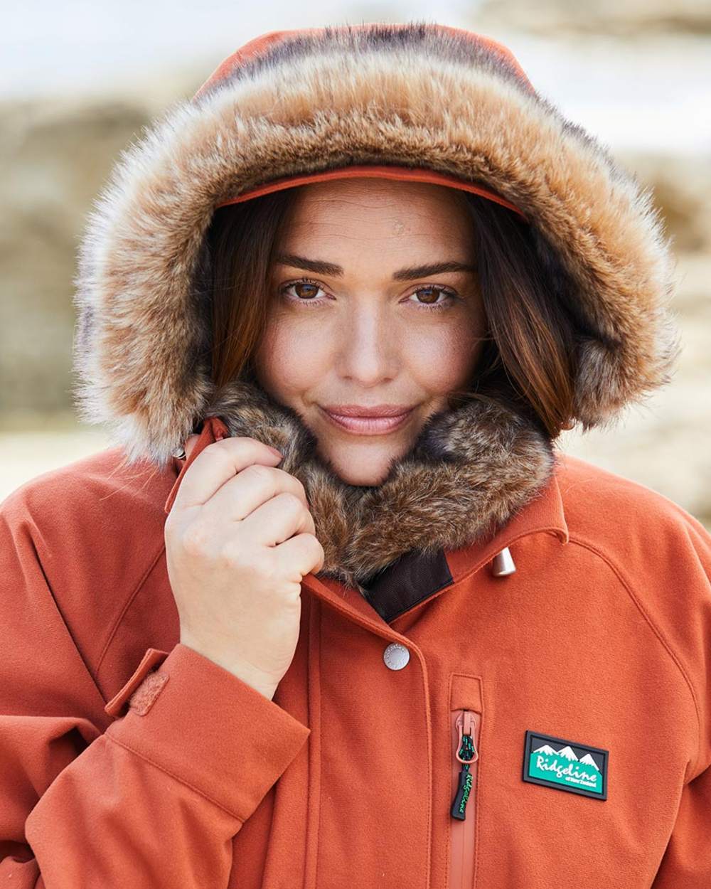 Russet coloured Ridgeline Ladies Monsoon Nordic Jacket on sea background #colour_russet