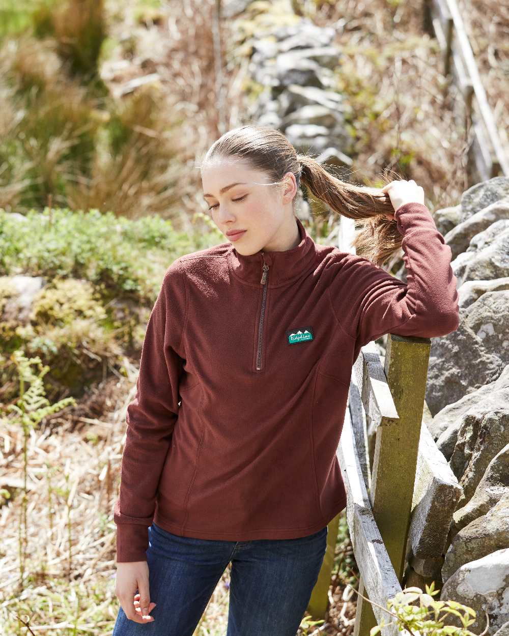 Oxblood coloured Ridgeline Ladies Narvik Fleece on farm background #colour_oxblood