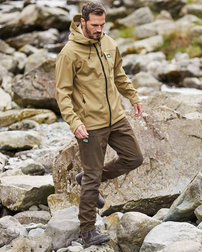 Faded Teak coloured Ridgeline Mens Gradient Jacket on rock background #colour_faded-teak
