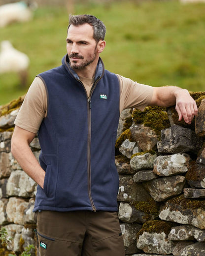 Navy Coloured Ridgeline Mens Kodiak Gilet on hilly background #colour_navy