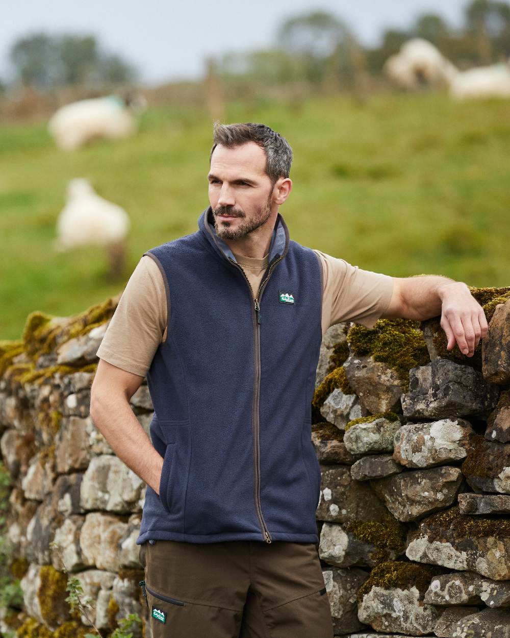 Navy coloured Ridgeline Mens Kodiak Gilet on backyard background #colour_navy
